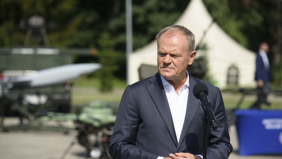 Poland's Prime Minister Donald Tusk speaks during a visit to the Technical Institute of the Polish Air Force in Warsaw, Poland, on July 30, 2025. The Prime Minister of Poland visits the Polish Air Force's Technical Institute where new warfare technologies, such as unmanned aerial vehicles (UAV), drones, composite technology, and defense and support systems for warfare operations, are being tested. Poland wants to spend 5% of its gross domestic product (GDP) on defense in 2026. (Photo by Aleksander Kalka/NurPhoto via Getty Images)