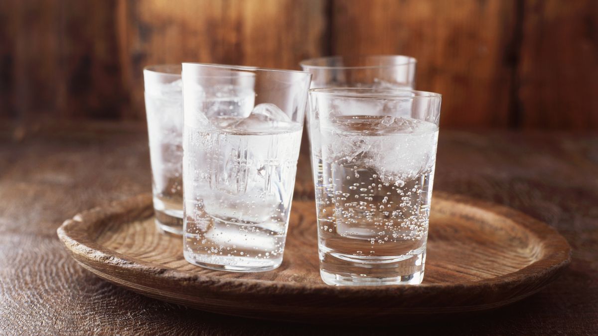 Sparkling water in drinking glass with ice on vintage wooden plateDiana Millercold temperature, drink, drinking glass, fizzy drinks, four objects, fresh, glass material, ice, indoors, nobody, plank, plate, purity, refresh, simplicity, sparkling water, still life, studio shot, vintage, wood, woodgrain pattern, London, United Kingdom