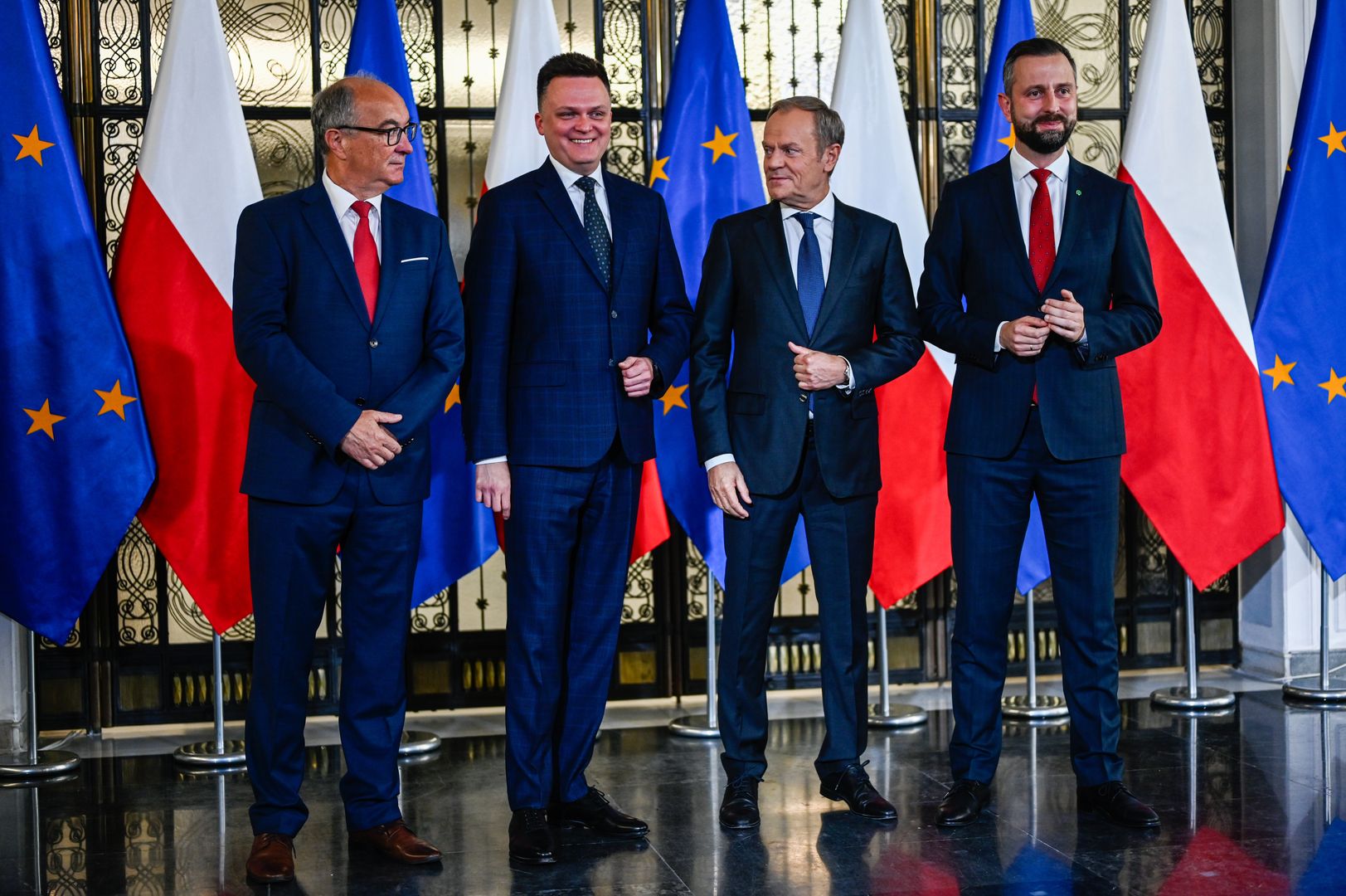 WARSAW, POLAND - OCTOBER 24: One of the leaders of the New Left, Wlodzimierz Czarzasty (L), the leader of Poland 2050 Party, Szymon Holownia (2nd L) , the leader of Civic Coalition (KO), Donald Tusk (2nd R), and the Leader of Polish People's Party (PSL), Wladyslaw Kosiniak Kamysz (R) stand together as they give a press statement in Warsaw, Poland on October 24, 2023. On Tuesday and Wednesday, Oct . 24 and 25 President Andrzej Duda will hold individual consultations with leaders of political parties that have won seats in the parliament of the new term. With the results of the Parliamentary elections out, Poland's democratic opposition made of the Civic Coalition, The Third Way Political alliance, and The New Left has the chance to rule with a majority and all have refused to enter a coalition with the ruling government party, Law and Justice. (Photo by Omar Marques/Anadolu via Getty Images)