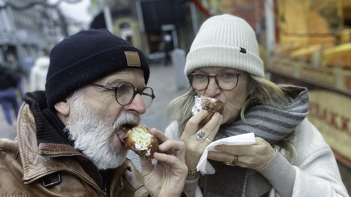 Couple Eating the Dutch Oliebol.
Retired Couple  eating a Dutch Oliebol.
middelveld