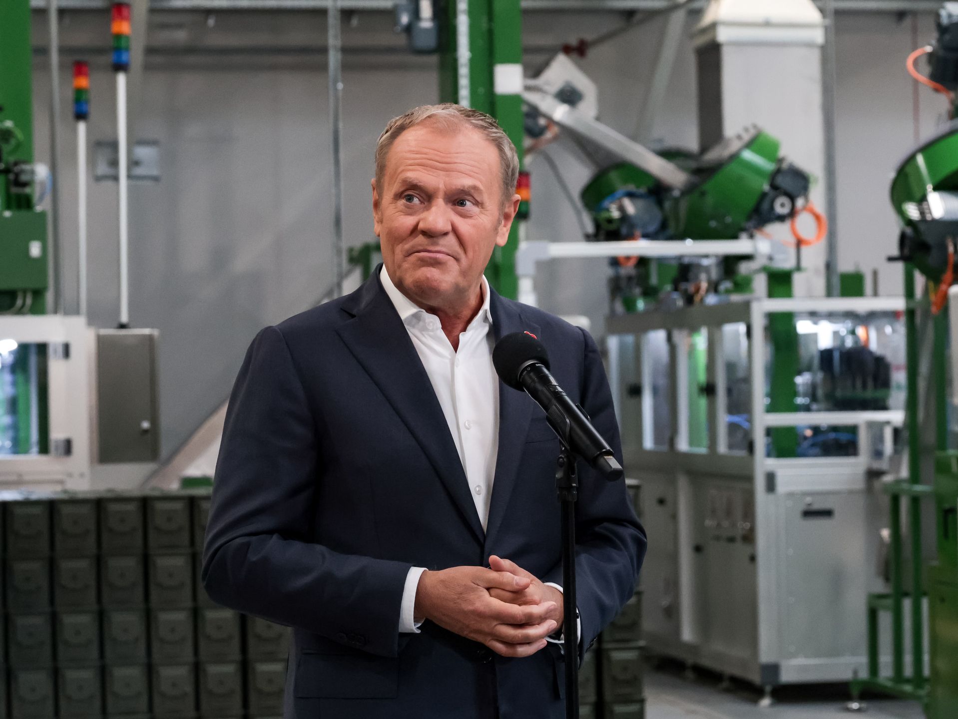 Prime Minister of Poland Donald Tusk speaks to the media during the press conference on an official opening day  of Project 400 - a new production hall of Mesko ammunition production company on June 13, 2025 in Skarysko Kamienna, Poland. Thanks to new production lines Mesko will increase production from 50 mln to 250 mln per year. (Photo by Dominika Zarzycka/NurPhoto via Getty Images)