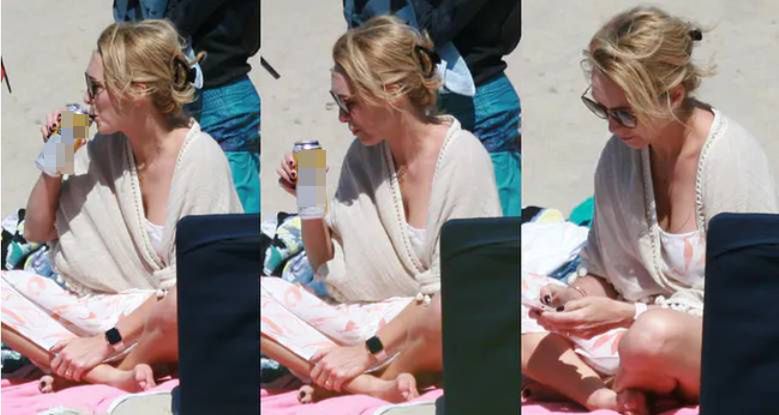 Anna Kalczyńska pije piwo na plaży i fotografuje pociechy
