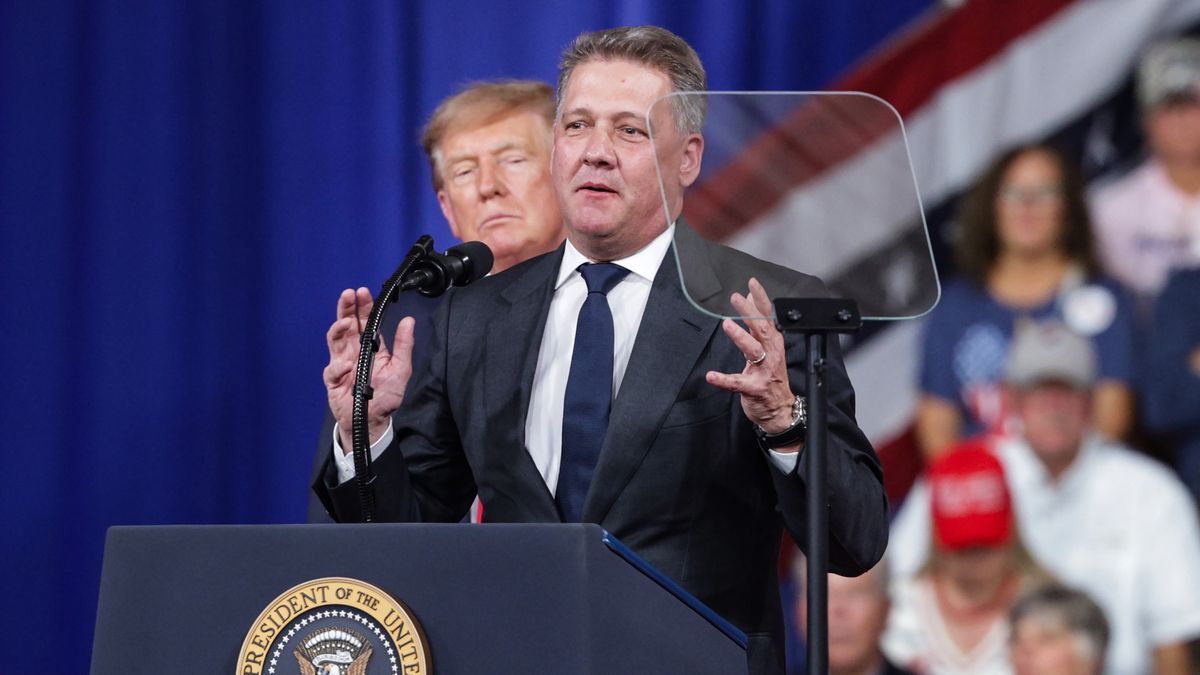 PERRY, GEORGIA - OCTOBER 24: Audi AG CEO Gernot Dollner speaks alongside U.S. President Donald Trump during a midterm campaign rally at the Guardian Centers on October 24, 2026 in Perry, Georgia. Trump is speaking at a rally in support of Georgia Republican Senate candidate, Rep. Mike Collins (R-GA), who is trying to unseat the incumbent U.S. Sen. Jon Ossoff (D-GA), and Georgia Republican gubernatorial candidate Rick Jackson. (Photo by Alex Wong/Getty Images)