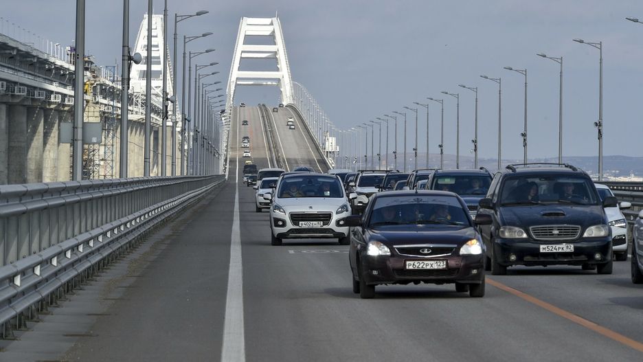 Temporary
Cars and other vehicles drive on the Crimean Bridge connecting Russian mainland and Crimean peninsula over the Kerch Strait after restoration works, not far from Kerch, Crimea on in Kerch, Crimea, Thursday, Feb. 23, 2023. All lanes of the Crimean bridge are fully open to car traffic 39 days ahead of schedule," Russian Deputy Prime Minister Marat Khusnullin said. The 17-kilometer (10.5-mile) bridge was opened in 2018, four years after Russia annexed Crimea from Ukraine. (Rosavtodor Press Service via AP)