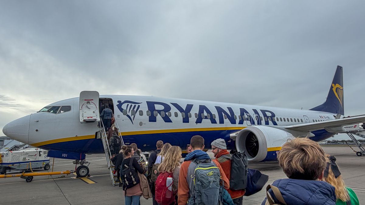BRISTOL, UNITED KINGDOM - OCTOBER 30: Passengers board a Ryanair aircraft that is parked on the runaway at Bristol Airport, on October 30, 2025 in Bristol, England. With projections for passenger traffic to more than double by 2050, aviation carbon emissions are projected to increase, especially in relation to other sectors as their emissions decline. Global commitments to reducing future Co2 carbon emissions will mean a huge investment is needed in green and renewable energy sources and infrastructure such as solar and wind farms so that economies can transition from getting energy from carbon and fossil fuels to that generated by clean sources. (Photo by Matt Cardy/Getty Images)