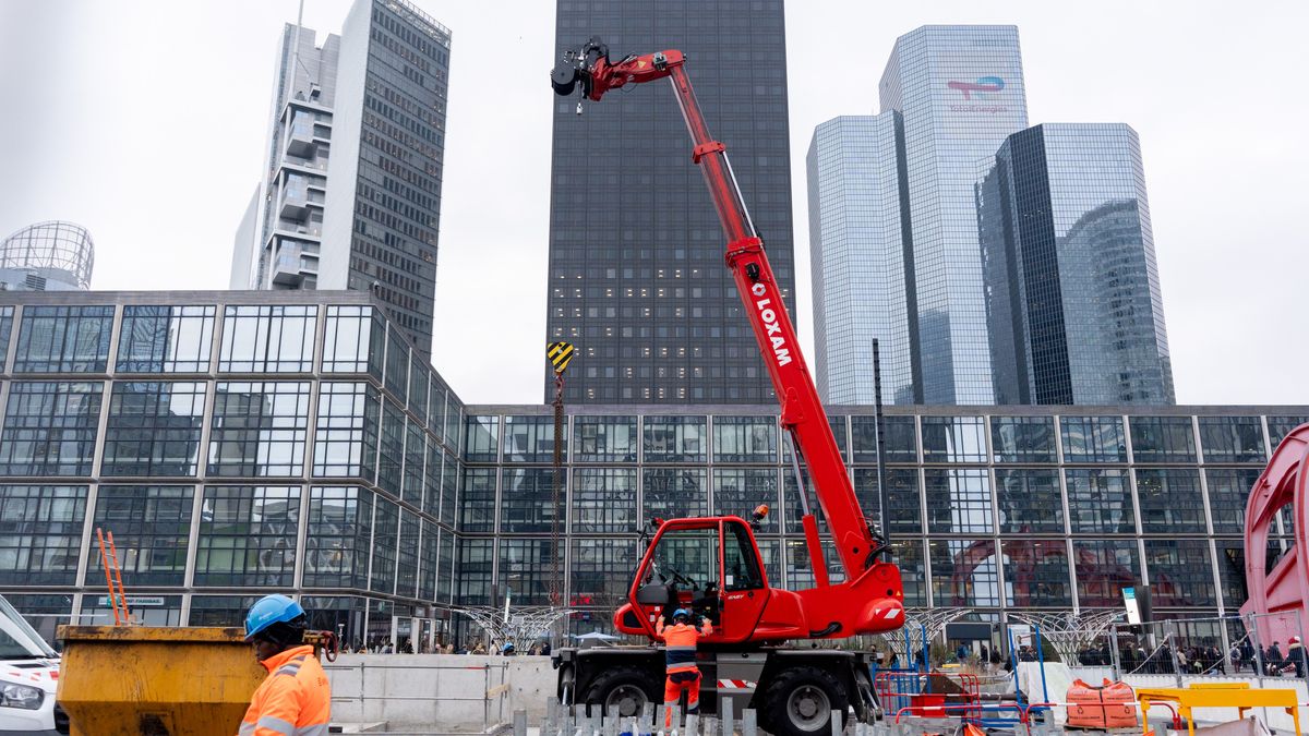 Construction workers at the La Defense business district in Paris, France, on Thursday, Feb. 20, 2025. France's economy is heading for only slight growth at the start of the year and uncertainty remains high for business leaders, the country's central bank said. Photographer: Nathan Laine/Bloomberg via Getty Images