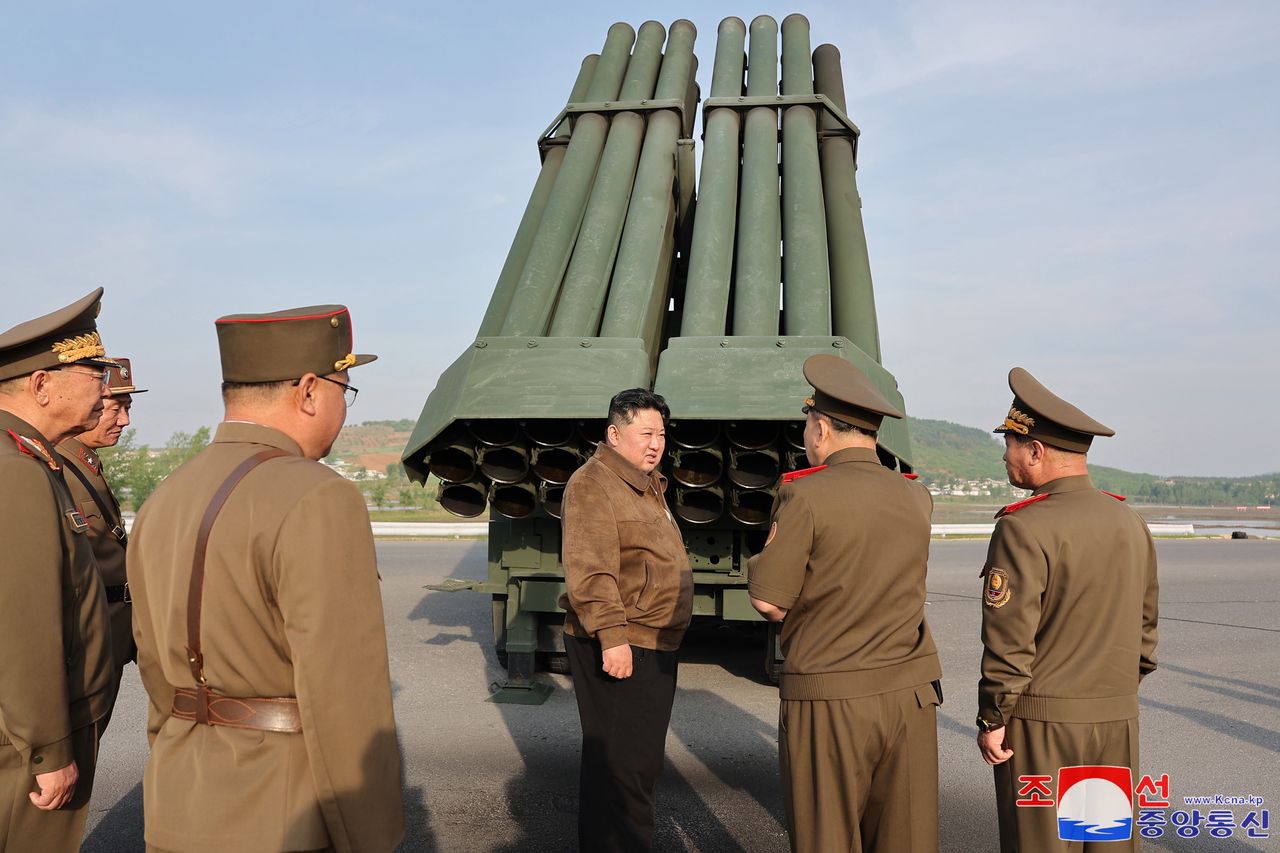 The photo published by the official North Korean Central News Agency shows the North Korean leader Kim Jong Un supervising a test firing of a multiple rocket launcher system of 240 mm caliber.