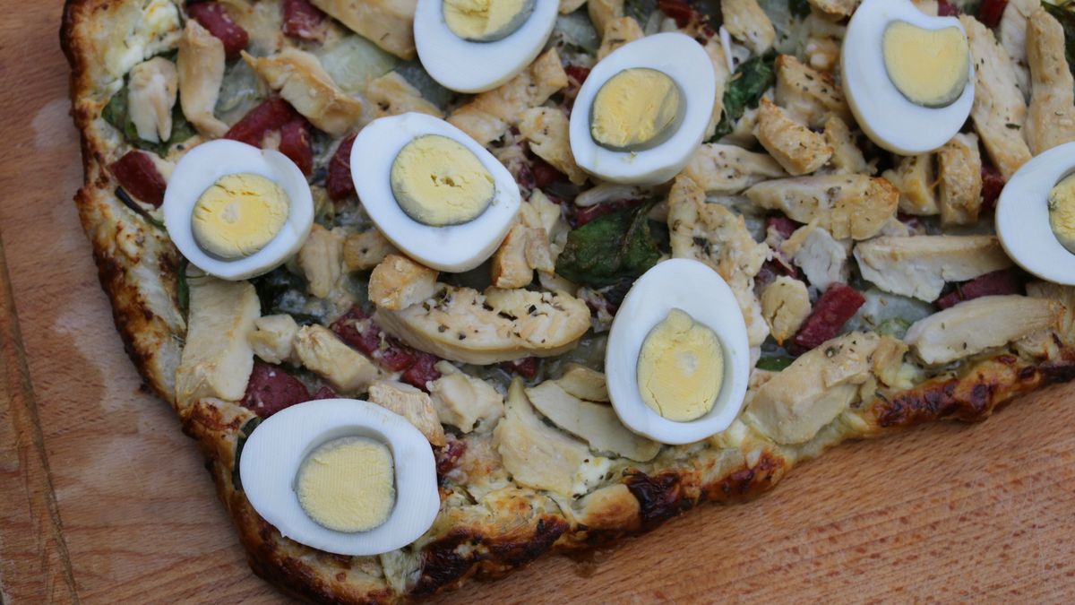 Image of rectangular homemade open top chicken pie pastry pizza tray bake using puff pastry baked in oven at bakery, fresh herbs, spinach, chorizo sausage, bacon, chicken, Cheddar / mozzarella cheese, cherry tomatoes, sliced boiled eggs, cress garnish
Stock photo of tasty summer lunch for outdoor family dining, homemade open top chicken pie made on a pizza base of puff pastry baked in oven at bakery, with boiled eggs and fresh herbs.
mtreasure