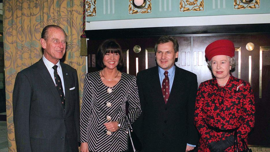 Queen In Poland
WARSAW, POLAND - MARCH 26:  Queen And Prince Philip With President Aleksander And Mrs Kwasniewski At A Lunch In The Hotel Bristol In Warsaw, Poland.  (Photo by Tim Graham Photo Library via Getty Images)
Tim Graham
Hands Clasped, Clasping Hands, Heads Of State, Luncheons, Royalty, Suits, Royal Tours, Relationships, Red Hat, Red And Black Dress, President, Presidents, Photocalls, Official Role, Mannerisms, Half Length, Europe
