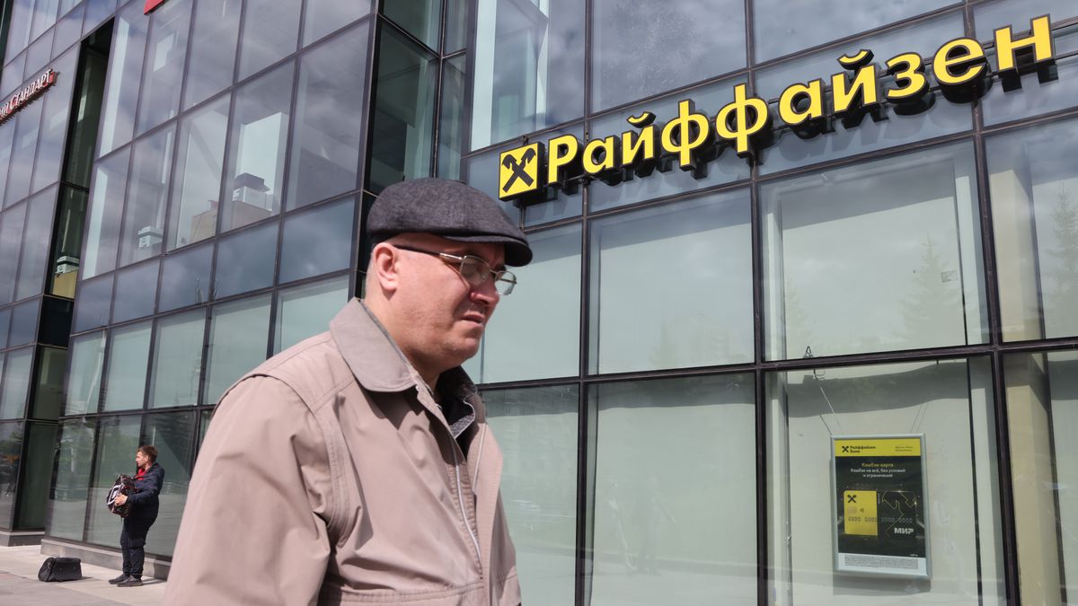 MOSCOW, RUSSIA - MAY 14: (RUSSIA OUT) A man plays an accordion near the branch of Raiffeisen bank on May 14, 2023 in Moscow, Russia. Austrian Raiffeisen Bank International AG (RBI) announced it was selling off its Russian banking business due to Western sanctions. (Photo by Contributor/Getty Images)
