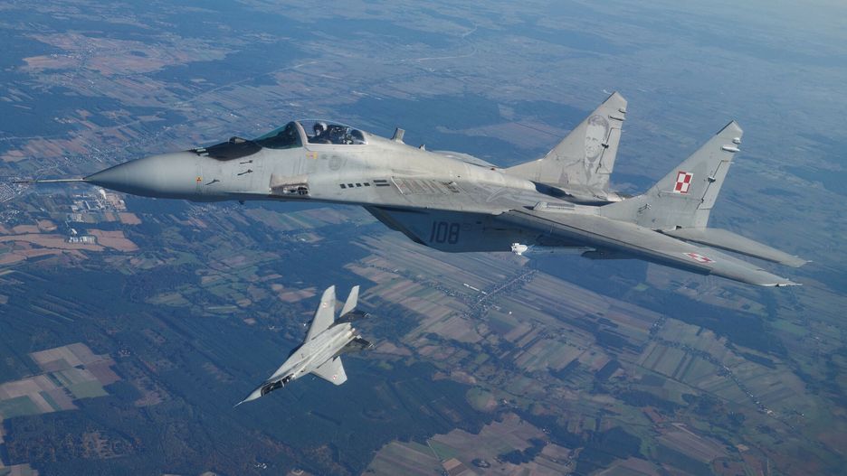 arch54
(FILES) This file photo taken on October 12, 2022 shows two MiG 29 fighter jets taking part in the NATO Air Shielding exercise near the air base in Lask, central Poland. - Polish President Andrzej Duda on March 16, 2023 said the EU member would deliver an initial batch of four Soviet-designed MiG-29 fighter jets to Ukraine soon. (Photo by RADOSLAW JOZWIAK / AFP)
RADOSLAW JOZWIAK