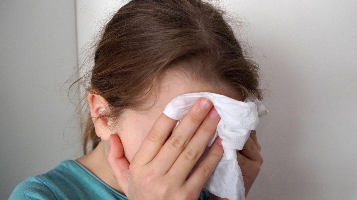 girl wipes her eyes with a napkingirl wipes her eyes with a napkinAnnadokaz