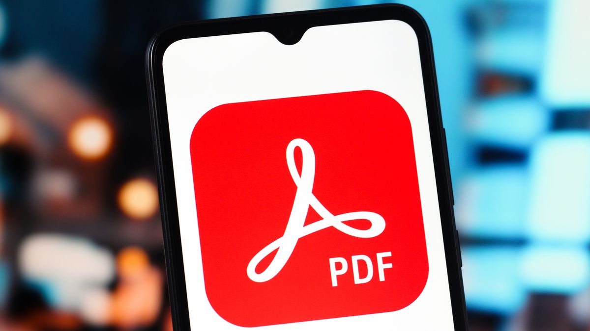 CANADA - 2025/11/26: In this photo illustration, the Adobe Acrobat Reader (PDF) logo is seen displayed on a smartphone screen. (Photo Illustration by Thomas Fuller/SOPA Images/LightRocket via Getty Images)