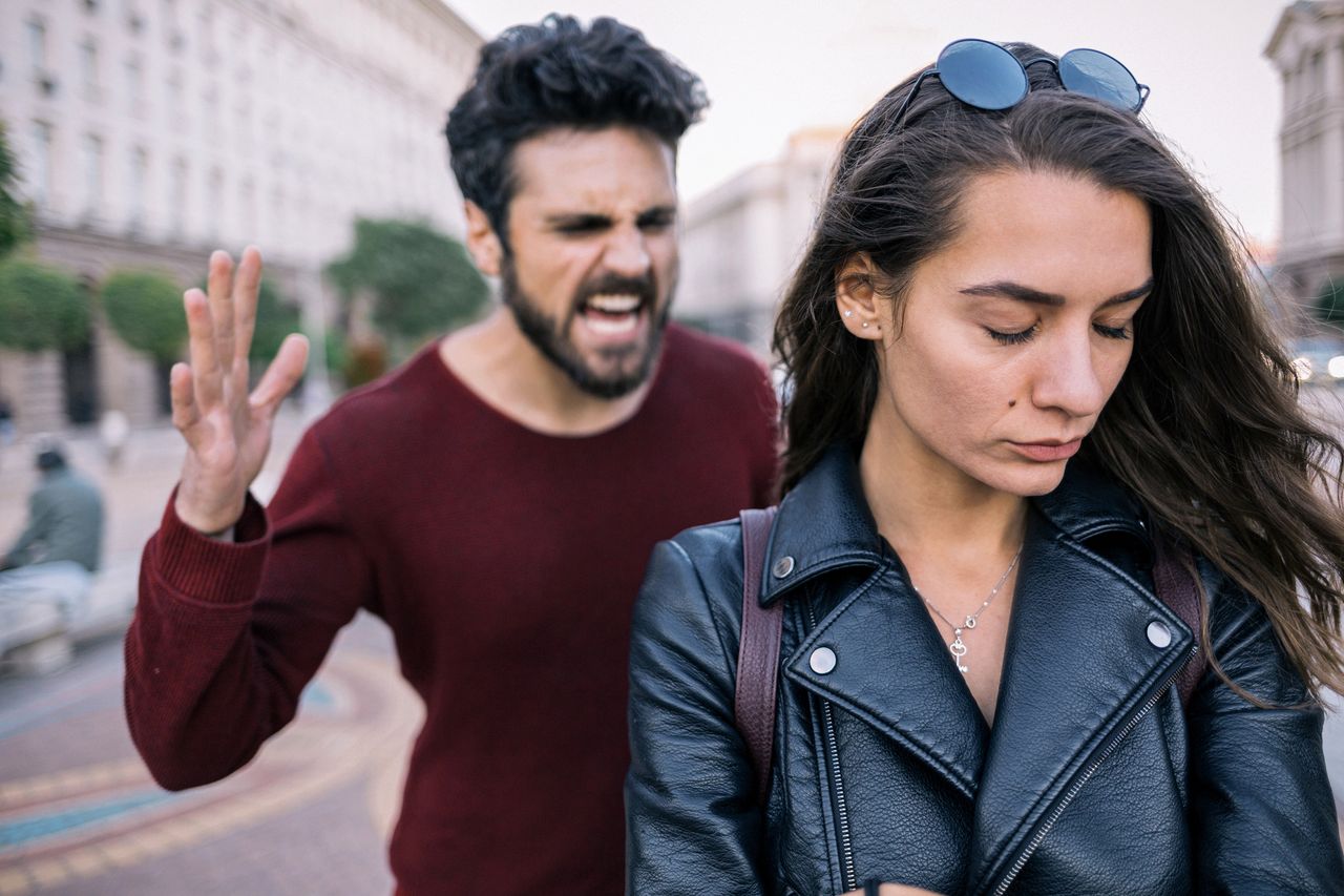 Bearded man shouting at his girlfriend