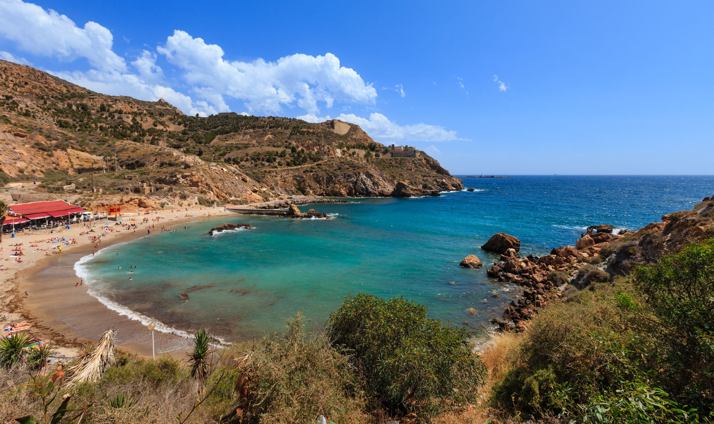 CARTAGENA, SPAIN -  MAY 28, 2016: Summer rocky coast view with beach (near Cartagena, Costa Blanca, Spain). 