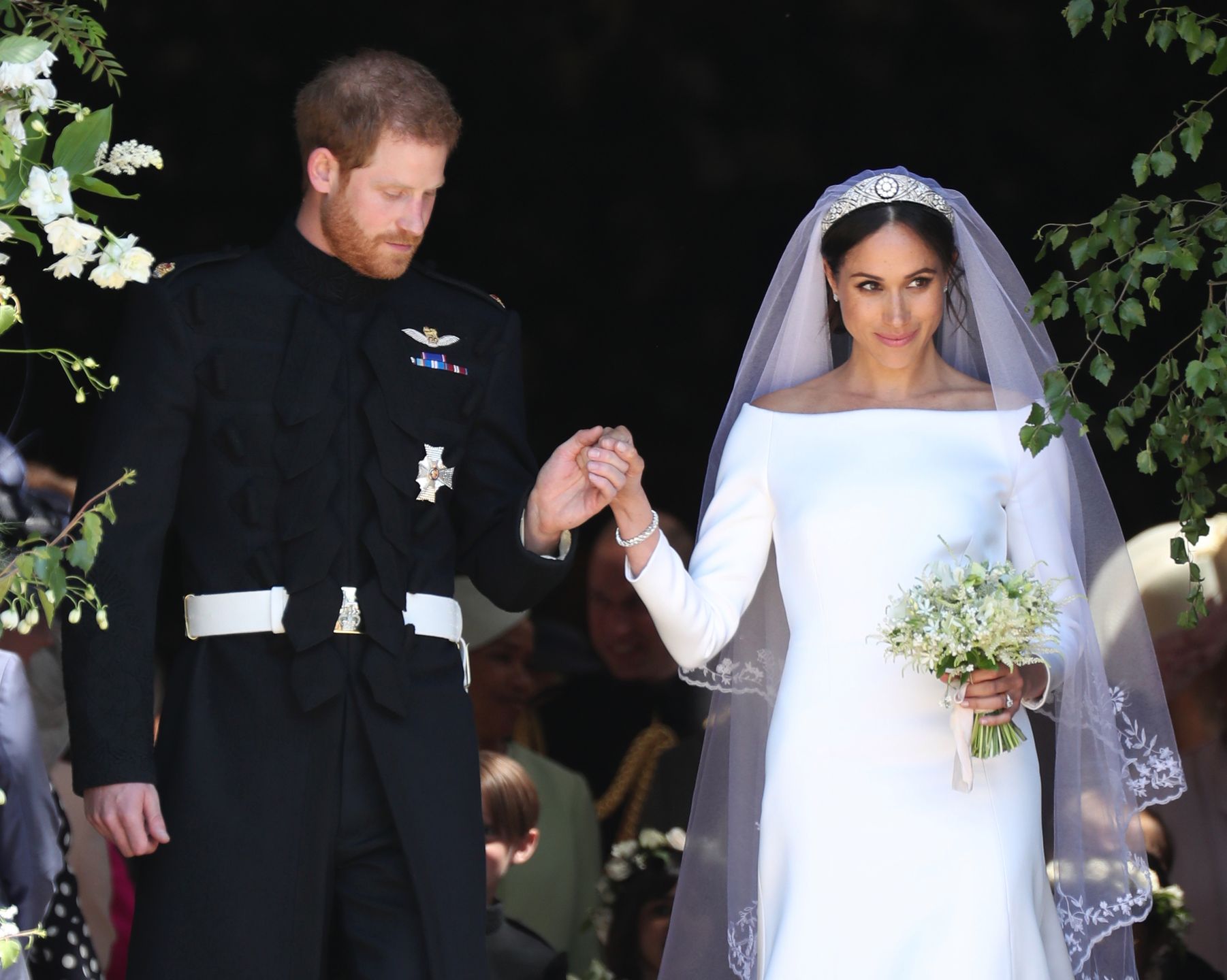 Meghan Markle and Prince Harry leave St George's Chapel at Windsor Castle following their wedding. PRESS ASSOCIATION Photo. Picture date: Saturday May 19, 2018. See PA story ROYAL Wedding. Photo credit should read: Jane Barlow/PA Wire 