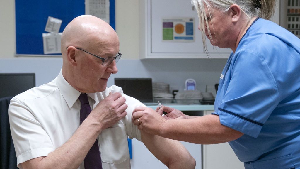 John Swinney receives his winter flu vaccination
First Minister of Scotland John Swinney receives his winter flu vaccination from charge nurse Nicky Grehan at Blairgowrie Community Hospital, Perthshire, as he highlights the importance of those eligible getting winter vaccinations when invited to protect themselves and others from vaccine preventable diseases at a time when viruses are circulating, and help protect the NHS this winter. Picture date: Monday November 25, 2024. (Photo by Jane Barlow/PA Images via Getty Images)
Jane Barlow - PA Images