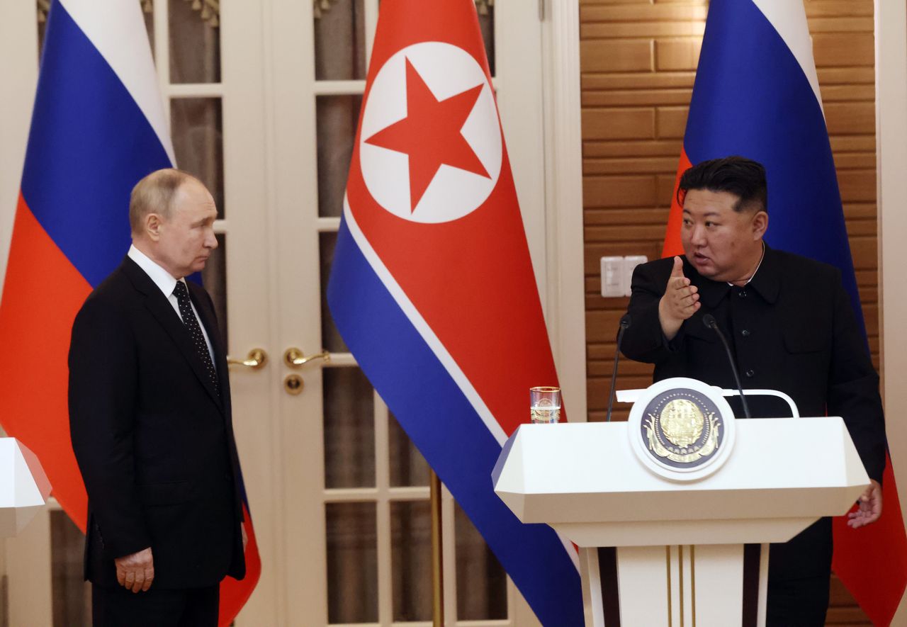 Vladimir Putin and Kim Jong Un