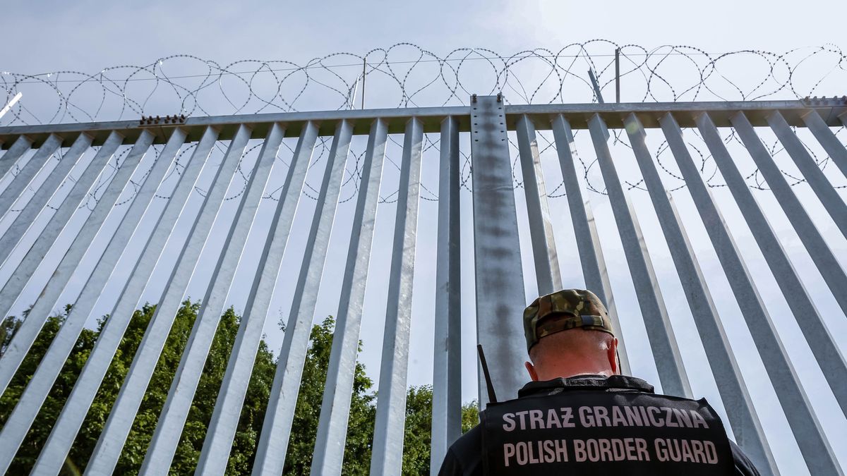 NOWODZIEL, POLAND - 2022/06/30: Border guard patrols the physical barrier built on the border between Poland and Belarus. The barrier was built in the first two quarters of 2022. The Polish government decided to build a 186 kilometre long and 5.5 meter high steel barrier with barbed wire on the Polish - Belarus border, which is as well the border of the European Union and NATO. The decision was made after thousands of migrants, mainly from Syria, Iraq and Afghanistan tried to cross into Poland from Belarus. The government of Belarus was accused of orchestrating the migration, with help from Russia. The pressure on the Polish border is today seen as the first step of a larger plan of Vladimir Putin, the Russian president, to destabilise the European Union. (Photo by Dominika Zarzycka/SOPA Images/LightRocket via Getty Images)