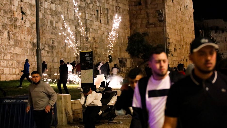 JERUSALEM - APRIL 15: Israeli forces intervene in Palestinians as they gather around the Damascus Gate after performing Tarawih prayer in Al-Aqsa Compound, in Eastern Jerusalem on April 15, 2021. (Photo by Mostafa Alkharouf/Anadolu Agency via Getty Images)