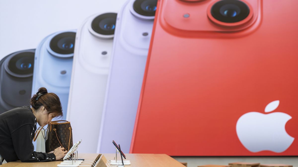 A customer browses Apple iPhone 14 smartphones at the Apple Inc. flagship store in Singapore, on Friday, Sept. 16, 2022. The latest iPhone hits stores Friday, and Apple Inc. is counting on well-heeled shoppers to make the device a hit during a year of roaring inflation and shaky technology spending. Photographer: Edwin Koo/Bloomberg via Getty Images