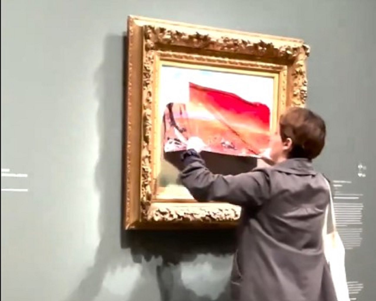 A climate activist taped up a famous painting.