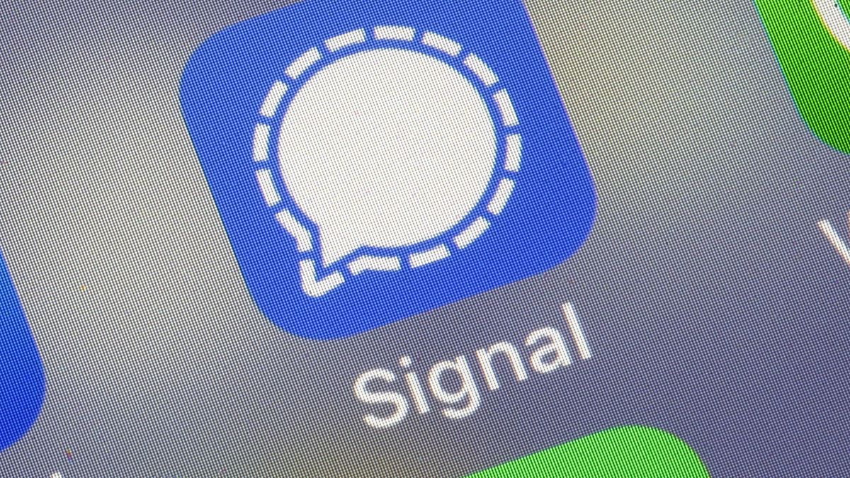 PARIS, FRANCE - JANUARY 11: In this photo illustration, the logos of social media applications, Facebook, Signal and WhatsApp are displayed on the screen of an iPhone on January 11, 2021 in Paris, France. In recent days, many WhatsApp users have migrated to Signal following the modification of WhatsApp's terms of use concerning personal data. WhatsApp has come under fire since Thursday after asking its nearly two billion users to agree to new terms of service, allowing it to share more data with its parent company Facebook. As a result, the Signal messaging application is experiencing a very strong increase in its subscriptions to the point of undergoing saturation phases. (Photo illustration by Chesnot/Getty Images)