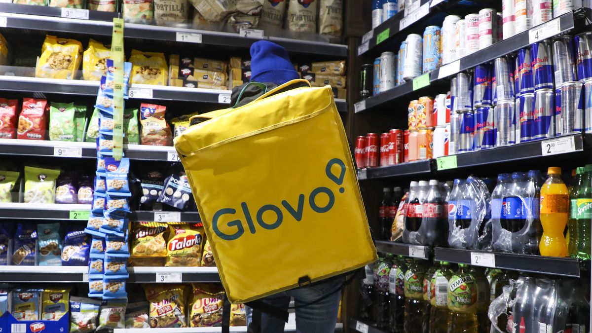 Glovo food delivery worker is making grocery shopping in Biedronka supermarket in Krakow, Poland on March 21, 2020. Since March 13, the country has been in a state of 'epidemic threat' due to the spread of coronavirus. That status has now been upgraded into a 'state of epidemic' which will give the authorities ability to, for example, transfer medical personnel and other government workers and introduce limits on transport. (Photo by Beata Zawrzel/NurPhoto via Getty Images)
