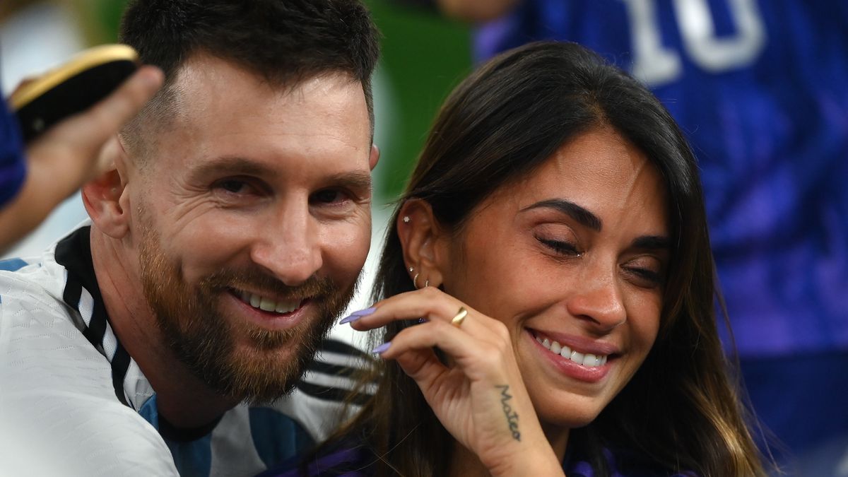 LUSAIL CITY, QATAR - DECEMBER 18: Lionel Messi of Argentina celebrates with his wife Antonela Roccuzzo and the FIFA World Cup Qatar 2022 Winner's Trophy following the FIFA World Cup Qatar 2022 Final match between Argentina and France at Lusail Stadium on December 18, 2022 in Lusail City, Qatar. (Photo by David Ramos - FIFA/FIFA via Getty Images)