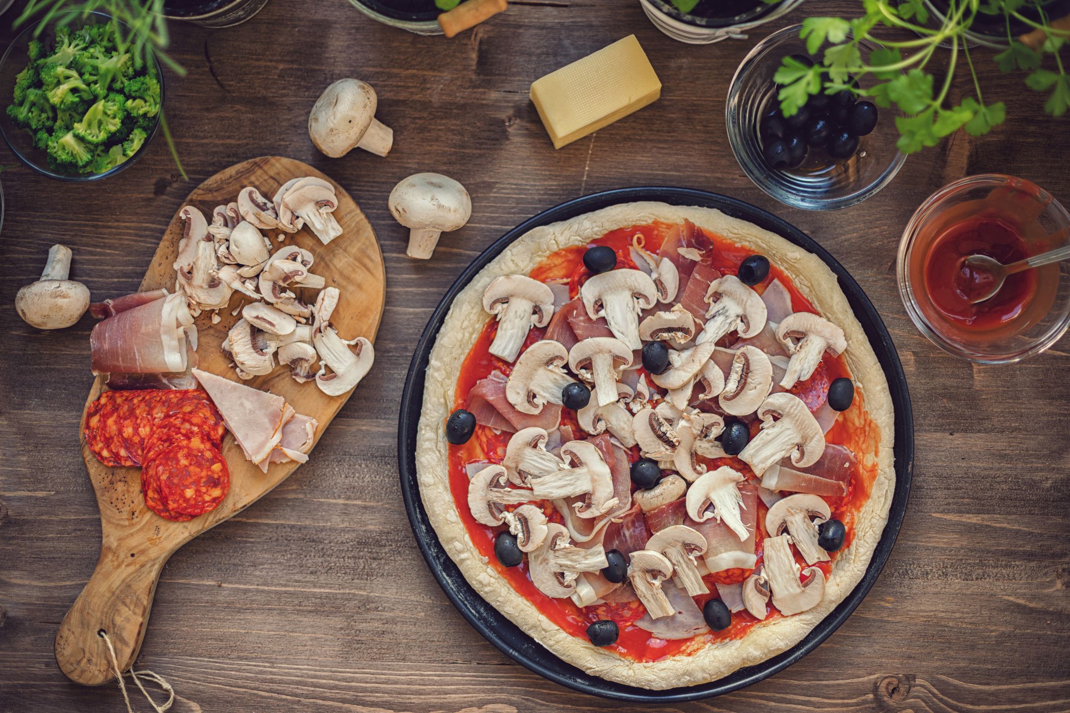 Preparing fresh pizza at home