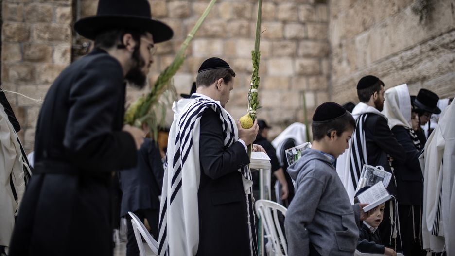 JERUSALEM - OCTOBER 02: Jews pray in front of Western (Al-Buraq) Wall during the Jewish holiday of Sukkot, which is a weeklong Jewish holiday that comes five days after Yom Kippur, in Old City of Jerusalem on October 02, 2023. (Photo by Mostafa Alkharouf/Anadolu Agency via Getty Images)