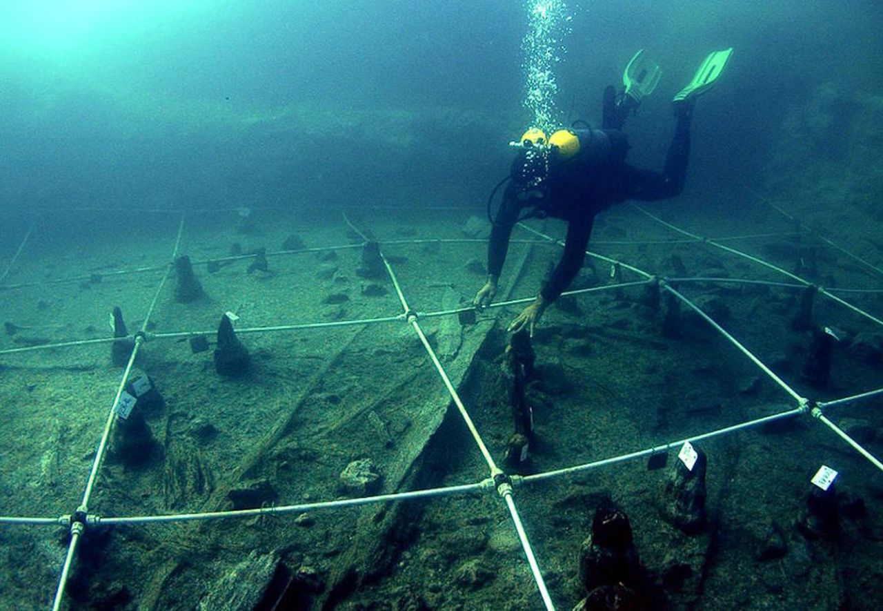 Diver at the bottom of the lake