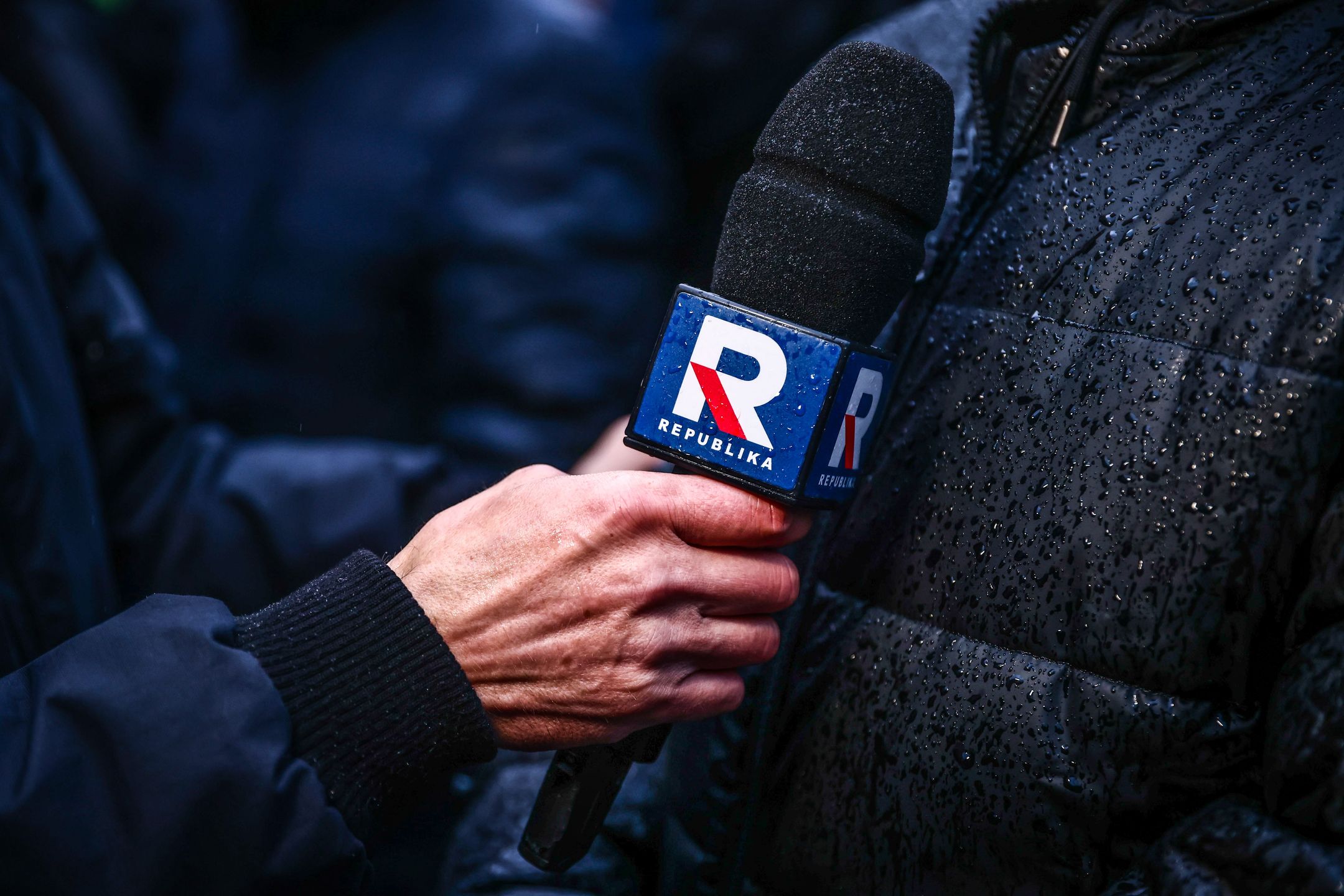 A journalist holds a microphone of TV Republika network during a protest against changes in publicly-owned media in front of the Provincial Office in Krakow, Poland on December 30, 2023. After winning general election Polish new pro-EU government took a public news channel TVP Info off the air and dismissed executives from other state media which served the right-wing Law and Justice Party during its eight years in power.

 (Photo by Beata Zawrzel/NurPhoto via Getty Images)