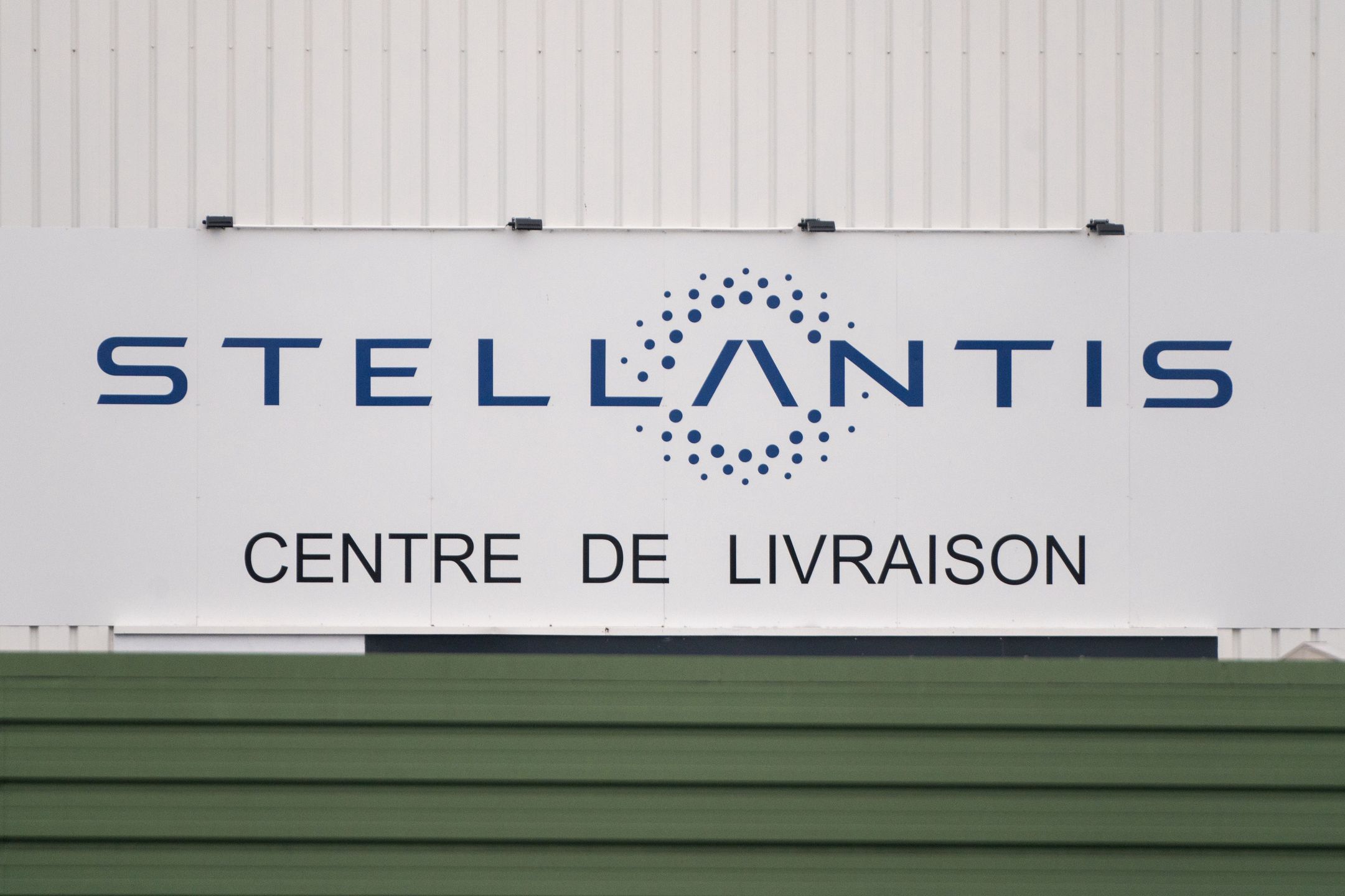A logo on the delivery center building at the Stellantis NV automobile plant in Poissy, France, on Monday, Oct. 30, 2023. Stellantis report earnings on Oct. 31. Photographer: Nathan Laine/Bloomberg via Getty Images