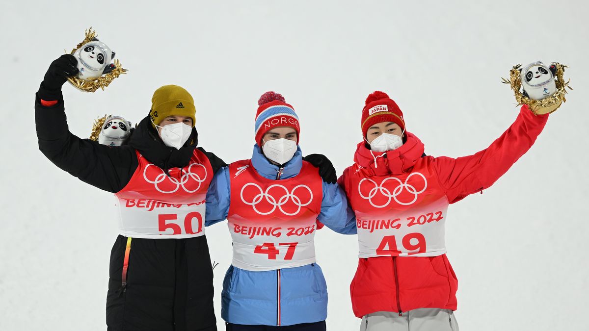 ZHANGJIAKOU, CHINA - FEBRUARY 12: Gold medal winner Marius Lindvik of Team Norway (C), Silver medal winner Ryoyu Kobayashi of Team Japan (R) and Bronze medal winner Karl Geiger of Team Germany (L) celebrate on the podium following the Men's Large Hill Individual Final Round on Day 8 of Beijing 2022 Winter Olympics at National Ski Jumping Centre on February 12, 2022 in Zhangjiakou, China. (Photo by Matthias Hangst/Getty Images)