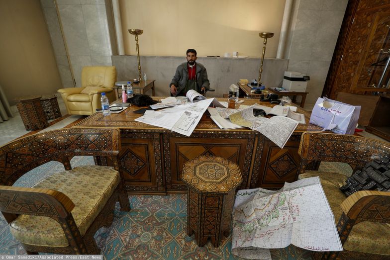 TemporaryA Syrian opposition fighter sits inside an office at the Presidential Palace after the Syrian government collapsed in Damascus, Syria, Sunday, Dec. 8, 2024. (AP Photo/Omar Sanadiki)Omar Sanadiki
