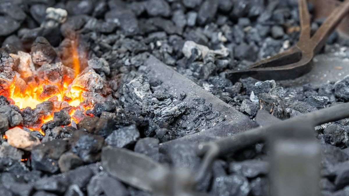 Close-up detail old medieval blacksmith furnace with hot burning coal flame forge iron metal. Craft smith farrier workshop fireplace with many professional craftsman tools equipmentClose-up detail old medieval blacksmith furnace with hot burning coal flame forge iron metal. Craft smith farrier workshop fireplace with many professional craftsman tools equipment.blacksmith, coal, iron, man, craft, burning, old, tools, equipment, ancient, fire, flame, forge, furnace, burner, hearth, handcraft, handmade, farrier, hot, smith, steel, fireplace, close, charcoal, metal, anvil, heat, barbecue, work, molten, smithy, traditional, coke, medieval, craftsman, ember, burn, grill, black, spark, cinder, oven, hammer, cast, process, tongs, craftsmanship, ironwork, workshop, blacksmith, coal, iron, man, craft, burning, old, tools, equipment, ancient, fire, flame, forge, furnace, burner, hearth, handcraft, handmade, farrier, hot, smith, steel, fireplace, close, charcoal, metal, anvil, heat, barbecue, work, molten, smithy, traditional, coke, medieval, craftsman, ember, burn, grill, black, spark, cinder, oven, hammer, cast, process, tongs, craftsmanship, ironwork