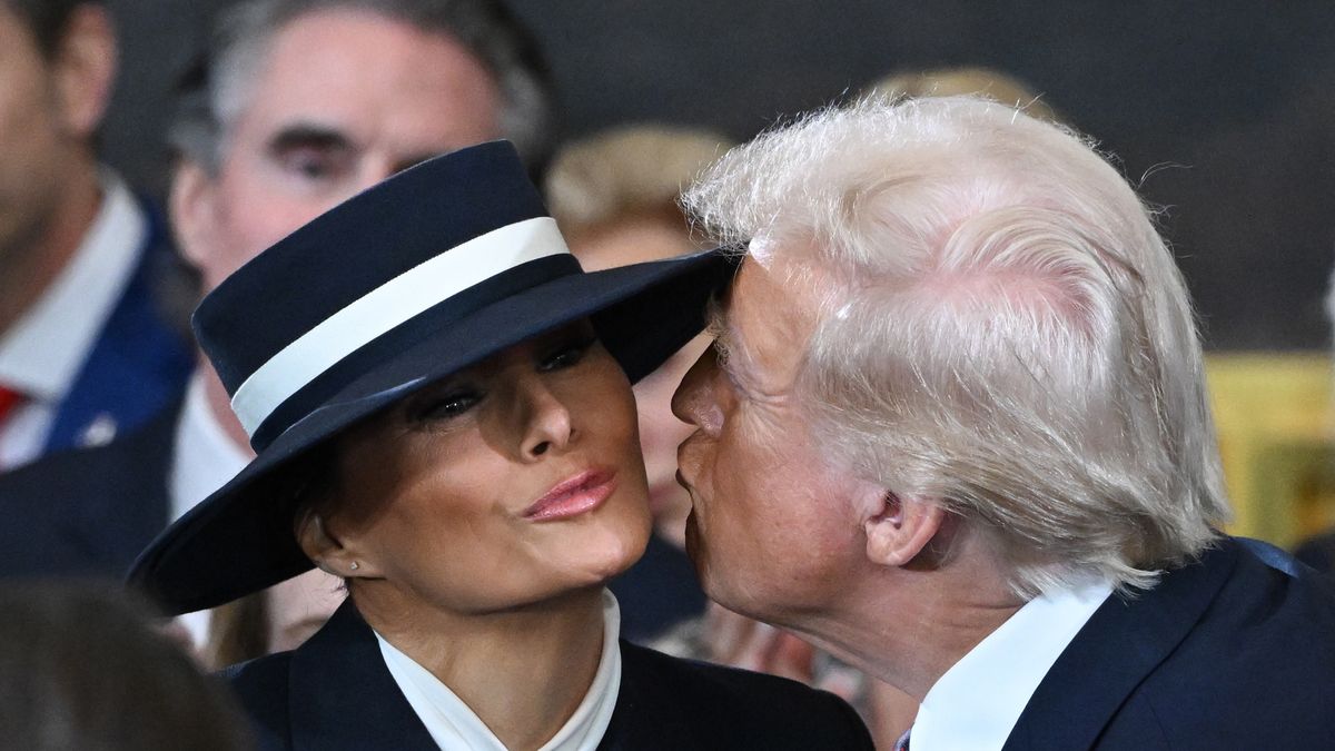 US President-elect Donald Trump, right, kisses Former First Lady Melania Trump during the 60th presidential inauguration in the rotunda of the US Capitol in Washington, DC, US, on Monday, Jan. 20, 2025. Donald Trump's Monday swearing-in marks just the second time in US history that a president lost the office and managed to return to power - a comeback cementing his place within the Republican Party as an enduring, transformational figure rather than a one-term aberration. Photographer: Saul Loeb/AFP/Bloomberg via Getty Images