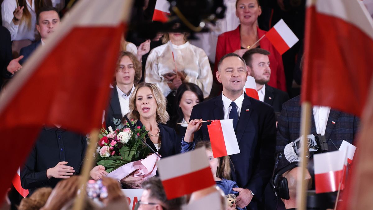Karol Nawrocki and his wife Marta Nawrocka are seen on stage at Law and Justice (PiS) party convention in Krakow, Poland on November 24th, 2024. Nawrocki, the head of Poland's state historical institute, was announced by PiS party to be a non-partisan, independent candidate for the President of the Republic of Poland in election next year.  (Photo by Beata Zawrzel/NurPhoto via Getty Images)