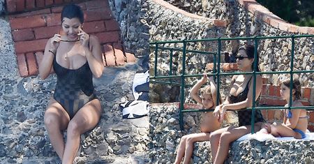 Ponętna Kourtney Kardashian wygrzewa się na portofińskiej skale w towarzystwie dzieci (ZDJĘCIA)