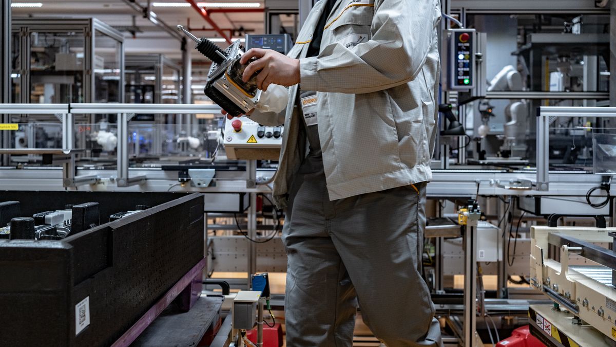 An employee places a part of an MK C2 brake system module in a container on the production line at the Continental AG manufacturing plant in Frankfurt, Germany, on Friday, March 3, 2022. The German auto supplier is scheduled to announce full year earnings on March 8. Photographer: Ben Kilb/Bloomberg via Getty Images