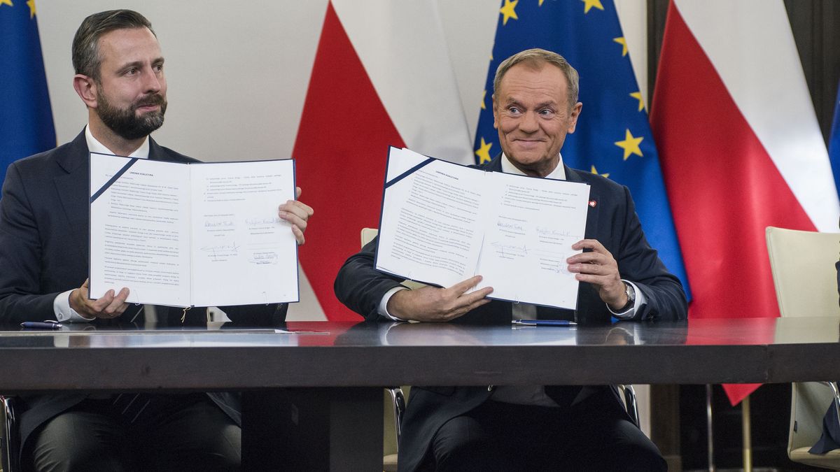 WARSAW, POLAND - 2023/11/10: Wladyslaw Kosiniak-Kamysz (L), head of the Polish People's Party, Donald Tusk (C), head of the Civic Coalition, Wlodzimierz Czarzasty (R), the co-chairman of the New Left party, show the signed coalition agreement in the Parliament. The leaders of Polish opposition parties have signed a coalition agreement that lays out a road map for governing the nation over the next four years. The parties collectively won a majority of votes in last month's parliamentary election. Their candidate to be the next prime minister is Donald Tusk, a former prime minister who leads the largest of the opposition parties, the centrist Civic Platform. Tusk said the parties worked to seal their agreement a day before the Independence Day holiday, adding that, "We wanted to show that we are ready to take responsibility for our homeland." He said the agreement would offer a set of "signposts and recommendations" for the government he plans to lead. (Photo by Attila Husejnow/SOPA Images/LightRocket via Getty Images)