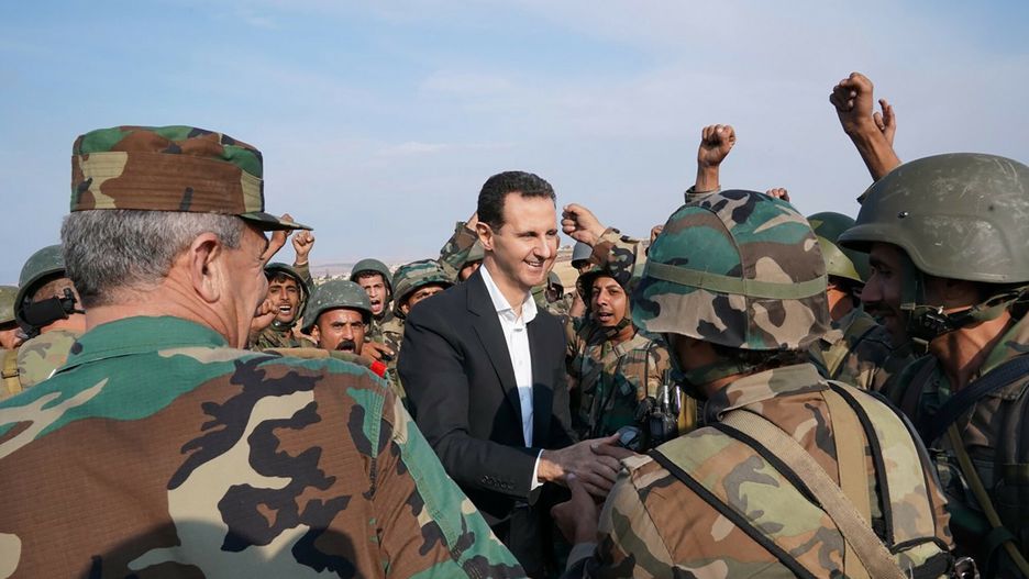 arch37
TOPSHOT - A handout picture released by the official Facebook page for the Syrian Presidency on October 22, 2019, shows Syrian soldiers cheering President Bashar al-Assad during his visit to al-Habit on the southern edges of the Idlib province. - Syrian President Bashar al-Assad visited government troops on the front line with jihadists in Idlib, his first visit to the northwestern province since the start of the conflict. (Photo by - / Syrian Presidency Facebook page / AFP) / RESTRICTED TO EDITORIAL USE - MANDATORY CREDIT "AFP PHOTO / Syrian Presidency Facebook page " - NO MARKETING NO ADVERTISING CAMPAIGNS - DISTRIBUTED AS A SERVICE TO CLIENTS
-