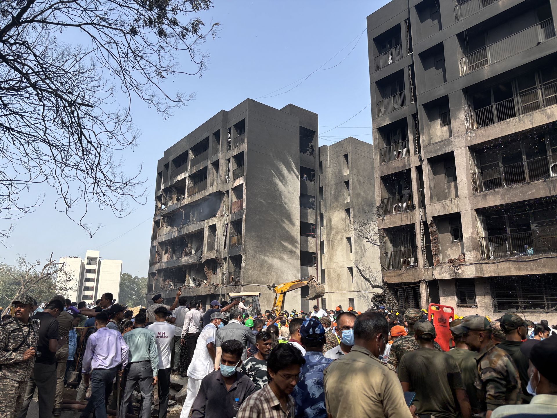 Air India plane with over 240 on board crashes after take-off in Ahmedabad
epa12171109 People gather at the site of a plane crash near Sardar Vallabhbhai Patel International Airport in Ahmedabad, Gujarat, western India, 12 June 2025. Air India flight AI171, bound for London carrying 242 passengers and crew members on board a Boeing 787-8 aircraft, crashed minutes after take-off in the Meghaninagar area of Ahmedabad.  EPA/SIDDHARAJ SOLANKI 
Dostawca: PAP/EPA.
SIDDHARAJ SOLANKI
flight AI171, plane crash, plane accident, Ahmedabad, Air India