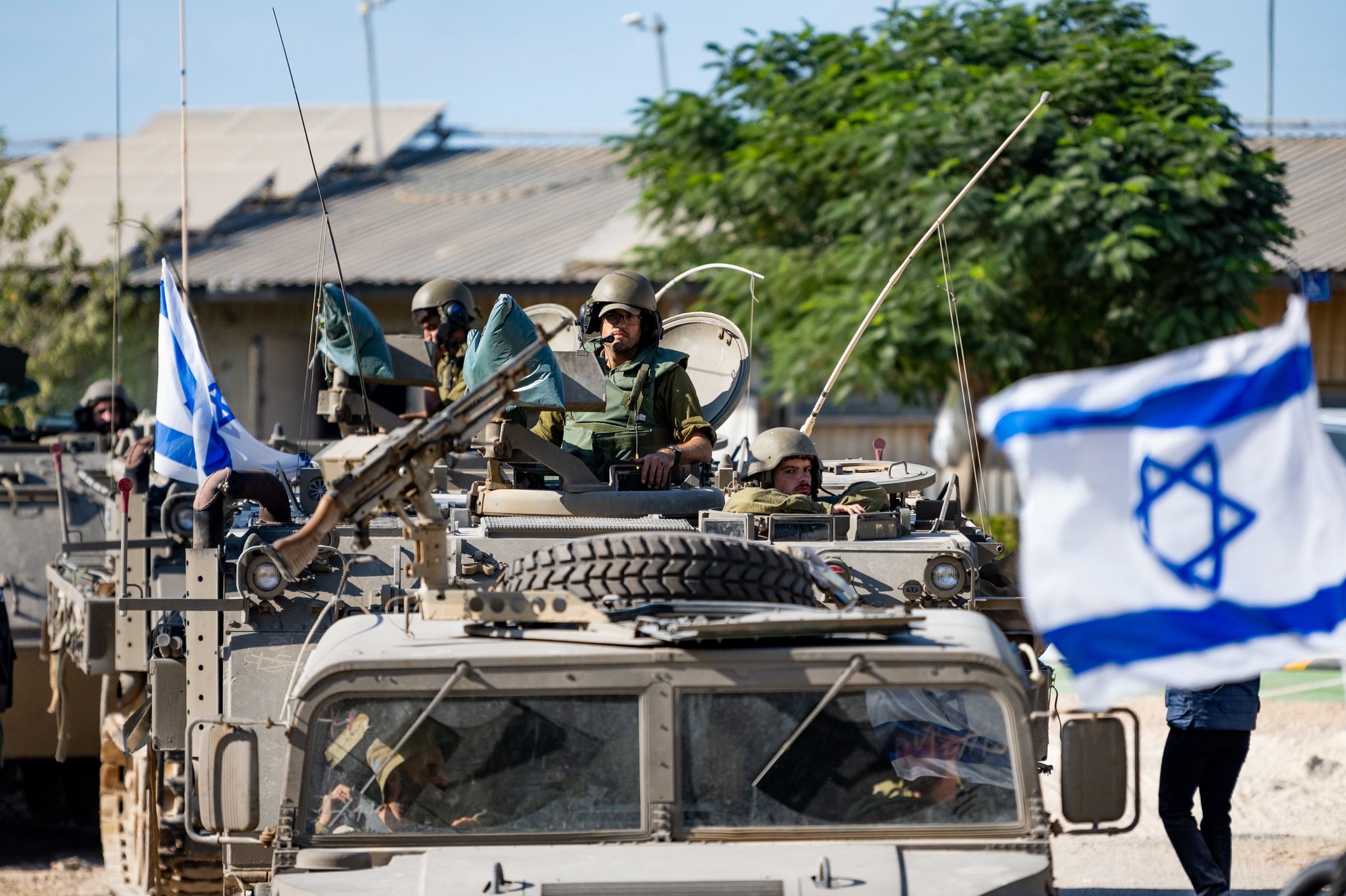Israel Poised To Invade Gaza As Worries Of Regional Escalation GrowBE'ERI, ISRAEL - OCTOBER 17: IDF Soldiers ride in armored personnel carriers on October 17, 2023 in Be'eri, Israel. As Israel prepares to invade the Gaza Strip in its campaign to vanquish Hamas, the Palestinian militant group Hamas who launched a deadly attack in southern Israel on October 7th, worries are growing of a wider war with multiple fronts, including at the country's northern border with Lebanon. Countries have scrambled to evacuate their citizens from Israel, and Israel has begun relocating some communities on its northern border. (Photo by Alexi J. Rosenfeld/Getty Images)Alexi J. Rosenfeld