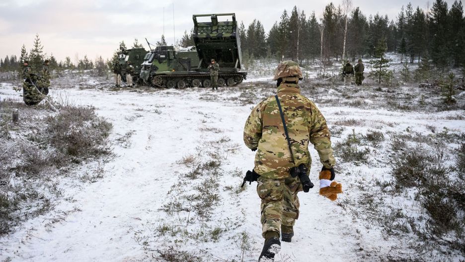 NATO Forces Carry Out Artillery Drills As Part Of 'Exercise Dynamic Front'
ROVANIEMI, FINLAND - NOVEMBER 20: A US soldier carries a NATO mascot stuffed toy to a photo opportunity during the NATO "Exercise Lightning Strike" on November 20, 2024 near Heinu, Finland. The live-fire exercise includes service members from 28 