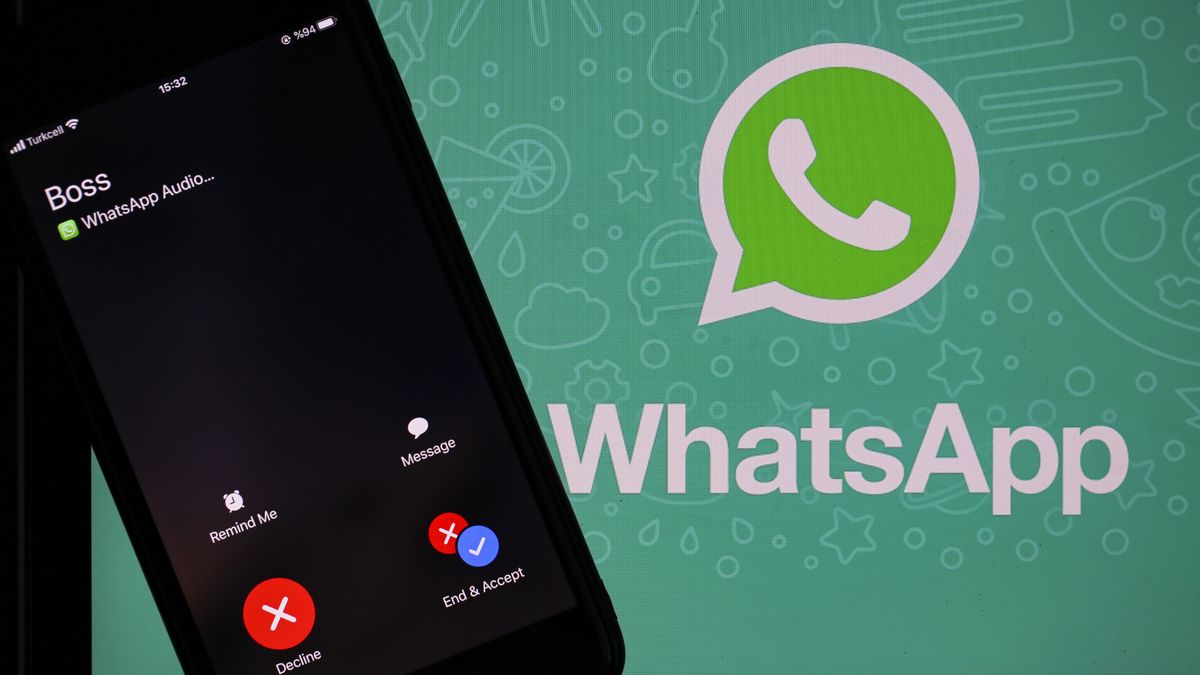 ANKARA, TURKEY - DECEMBER 03: The logo of Whatsapp is seen near a smartphone in Ankara, Turkey on December 03, 2019. (Photo by Muhammed Selim Korkutata/Anadolu Agency via Getty Images)
