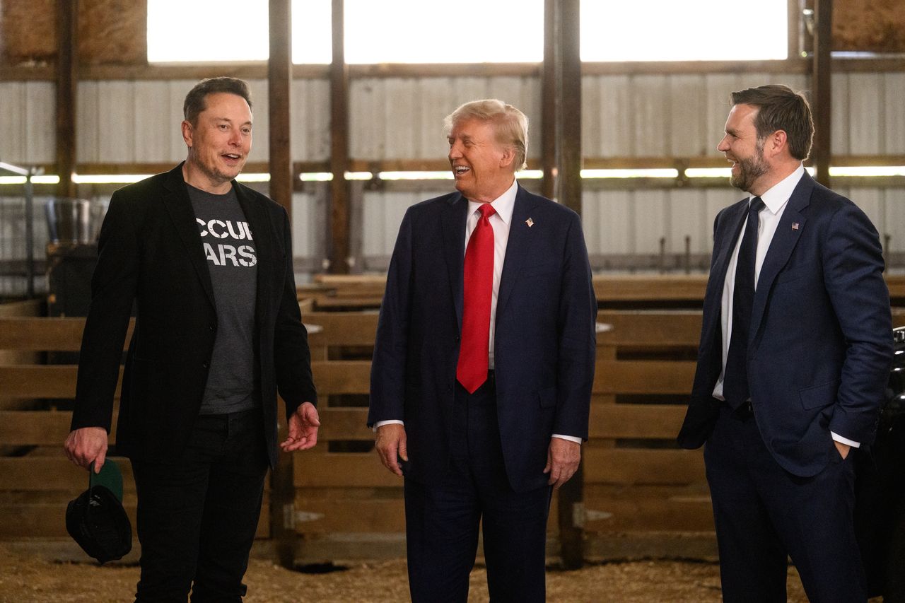 Former US President Donald Trump, center, and Senator JD Vance, right, a Republican from Ohio and Republican vice-presidential nominee, greet Elon Musk, chief executive officer of Tesla Inc., backstage prior to a campaign event at the Butler Farm Show in Butler, Pennsylvania, US, on Saturday, Oct. 5, 2024. Elon Musk will campaign with the former president on Saturday, joining a rally at the scene of a summer assassination attempt and cementing his role as one of the Republican candidate's key backers. Photographer: Justin Merriman/Bloomberg via Getty Images