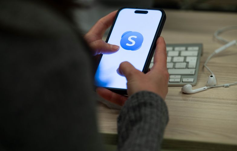ANKARA, TURKIYE - FEBRUARY 28: A person holds a mobile phone displaying Skype application, in Ankara, Turkiye on February 28, 2025. (Photo by Didem Mente/Anadolu via Getty Images)