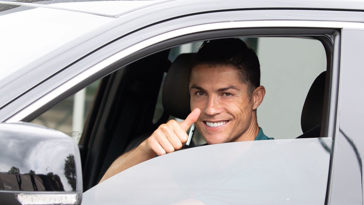 TURIN, ITALY - MAY 19: Juventus' Portuguese forward Cristiano Ronaldo exit in his car to resume training after a quarantine on May 19, 2020 at the club's Continassa training ground in Turin, as the country's lockdown is easing after over two months, aimed at curbing the spread of the COVID-19 infection, caused by the novel coronavirus. during the   Cristiano Ronaldo arrival at the Turin on May 19, 2020 in Turin Italy (Photo by Mattia Ozbot/Soccrates/Getty Images)
